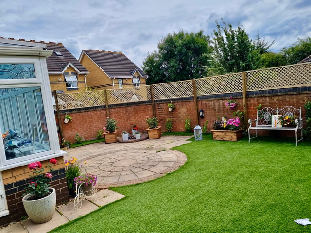 Diamond timber trellis installed above a brick garden wall with timber posts