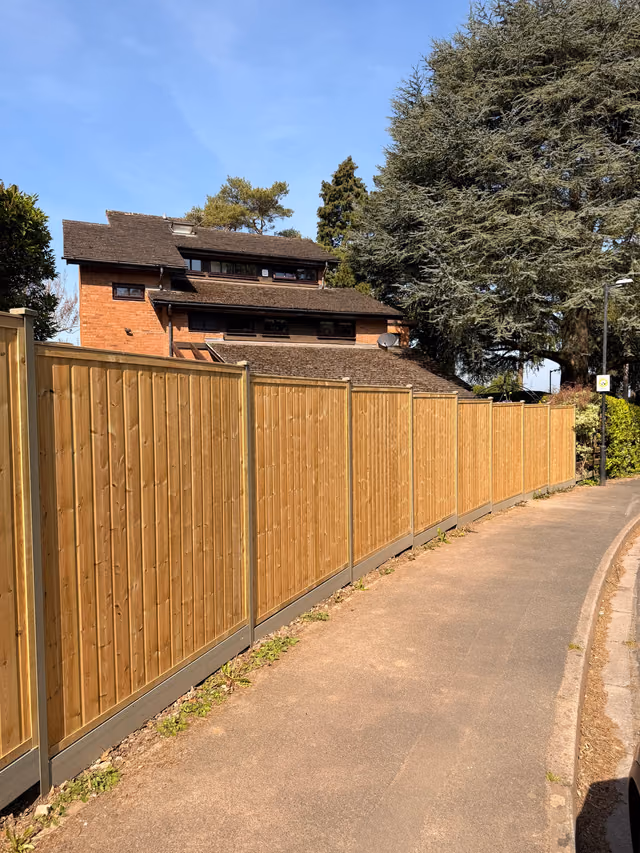 Premium tongue-and-groove fence panels with olive green DuraPost supports