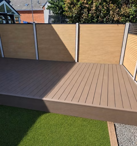 NeoTimber Classic chocolate composite decking beside the Willow composite fence in the same Stoke Gifford garden