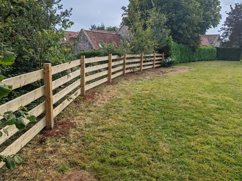 Bespoke open timber fence designed to keep a dog secure in a Westbury-on-Trym garden